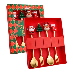 Golden 4-piece Christmas cutlery set with Santa, tree, and reindeer in a red gift box