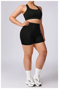 Plus size black sports set with racerback bra and high-waist compression shorts