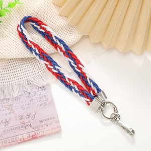 Close-up of red white and blue braided wrist strap with silver metal lobster clasp
