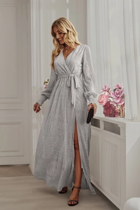 Detail of silver sequin long sleeve wrap dress with V-neck, waist tie and side slit