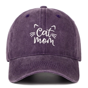 Detail of white Cat mom embroidery and cat ears on dark purple washed cotton baseball cap