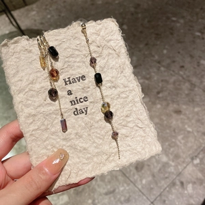 Handheld crystal beaded tassel earrings with gold chain in vintage asymmetric design