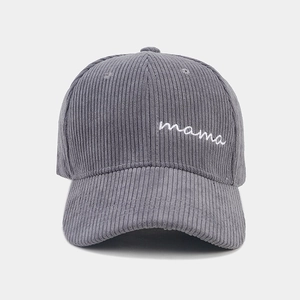 Detail of white mama embroidery on gray corduroy baseball cap with soft texture