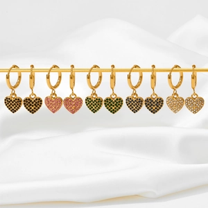 Detailed display of colorful zircon heart earrings in six variants on a gold display stand