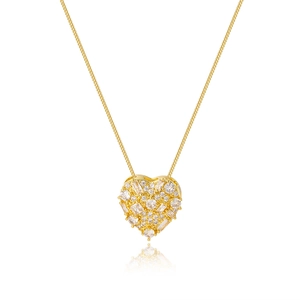 Macro shot of gold-plated heart pendant encrusted with sparkling cubic zirconia on chain