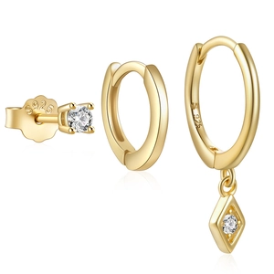 Macro view of S925 sterling silver gold-plated Evil Eye earrings with clear zircons