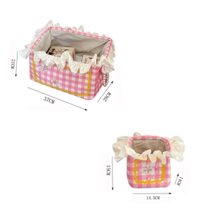 Detail showing dimensions of pink checkered storage baskets with cream ruffled lace edges