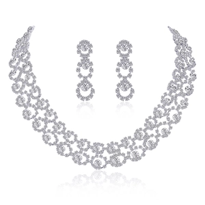 Elegant silver jewelry set with necklace and drop earrings featuring marquise crystals