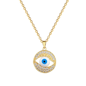 Luxurious gold evil eye necklace with crystals and blue eye pendant on white background