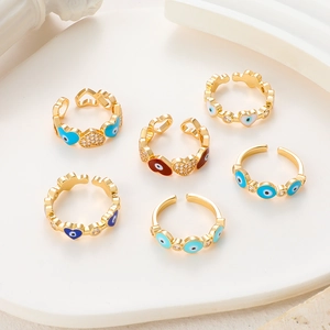 Detail of 14k gold plated evil eye rings with enamel inlay and sparkling zircon stones