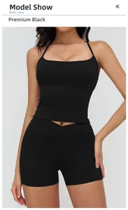 Detail of black yoga set featuring square neck tank top and cross waist sports shorts