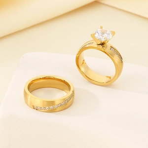 Elegant 18K gold-plated stainless steel four-prong solitaire and pavé diamond ring set