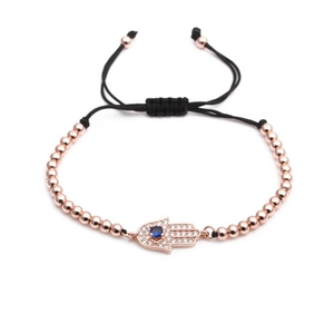 Rose gold Hamsa Hand bracelet with micro-paved zircons and adjustable black cord
