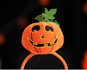 Detailed view of plush orange pumpkin headband with fine embroidery for Halloween parties
