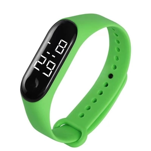 Detailed view of digital watch with green silicone strap and LED display