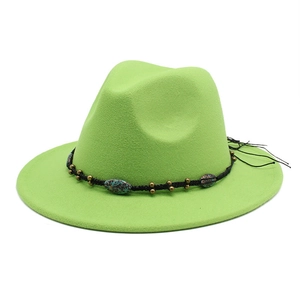 Detail of bright green wool fedora with black beaded band and turquoise stone accents