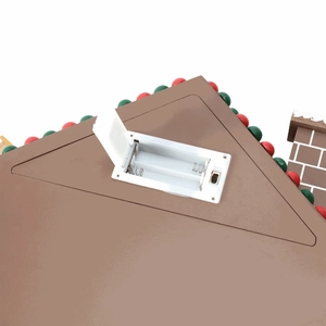 Detail of white battery box with open lid on brown roof of Christmas advent house