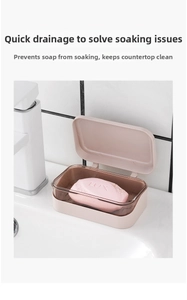 Detail view of a double-layer soap box with drainage lid on a white bathroom vanity