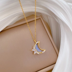 Titanium steel moon necklace with crystals on white silk background for women