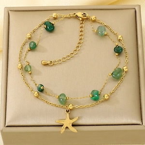 Detail of double-layer stainless steel anklet with green agate and starfish charm