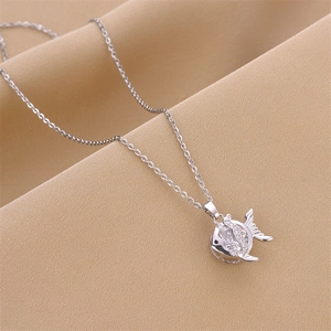 Elegant silver fish pendant necklace featuring sparkling white zircons on a textured background