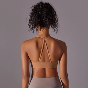 Detailed back view of a high-stretch nude yoga bra featuring a crisscross Y-shaped strap design
