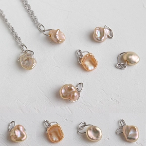 Elegant natural Baroque pearl necklace with unique water ripple texture and silver chain