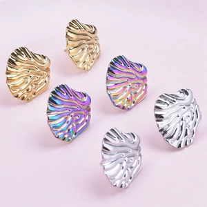 Three pairs of wavy stainless steel stud earrings in gold, silver, and rainbow plating
