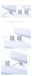 Macro detail of S999 sterling silver four-leaf clover earrings with sparkling zircon stones