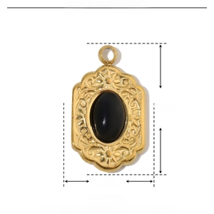 Macro view showing dimensions of black natural stone oval pendant in gold stainless steel