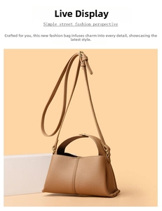 Close-up of light brown lychee grain leather mini bag with fine stitching details