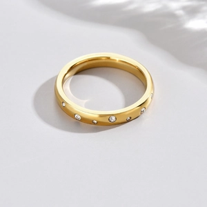Gold plated stainless steel wide ring featuring micro-pave cubic zirconia accents