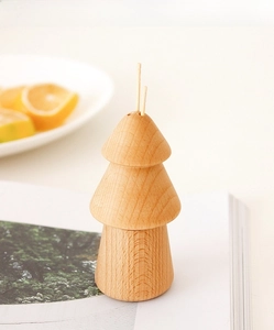 Macro detail of natural pine tree shaped wooden toothpick holder with smooth wood grain