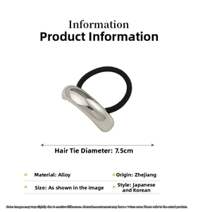 Macro detail of elastic hair tie with silver curved alloy charm and 7.5cm diameter