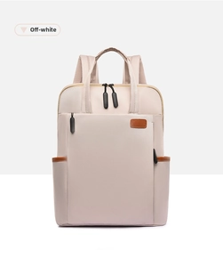 Detail of off-white nylon backpack with brown leather accents and contrast zippers