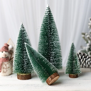 Set of four mini green bottle brush Christmas trees with natural wood bases for decor