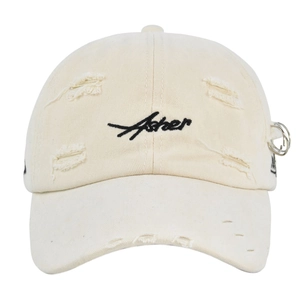 Detail of distressed beige cotton baseball cap with Asher embroidery and metal rings