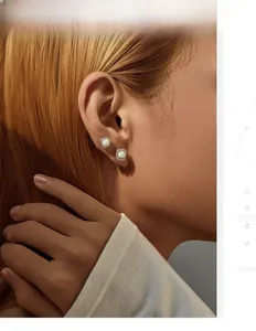 Macro detail of S925 silver opal stud earrings with shimmering zircon halo on ear