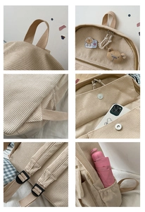 Detalle de mochila de pana con asa ancha, cremallera metálica y un tierno parche de oso