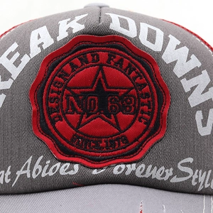 Macro detail of vintage baseball cap with 3D embroidery and red star emblem patch