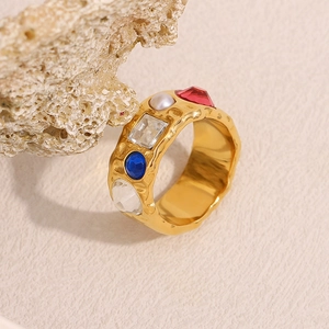 Detail of 18K gold-plated textured ring with multi-color stones and faux pearl inlay