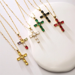 Cross necklace with gold chain and colorful zircon stones in various vibrant gemstone colors