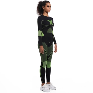 Détail de l'ensemble de compression sport sans couture noir et vert fluo pour femmes