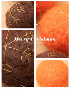 Close-up of handmade felt Christmas ornaments with gold snowflake embroidery in warm tones