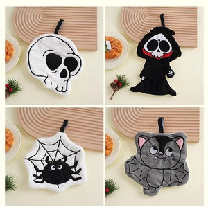 Close-up of Halloween coral fleece towels with skull, bat, and spider hanging loops