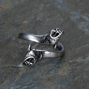Adjustable silver Viking dragon ring with dual-head design on a natural grey slate stone
