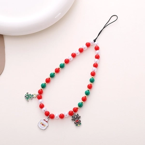 Close-up of Christmas phone charm with red green white beads and festive pendants