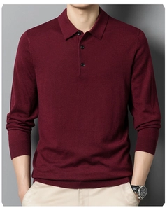 Detail of burgundy knitted long sleeve polo sweater with three-button collar closure