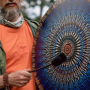 Outdoor shaman drum with colorful mandala pattern and soft-headed mallet stick