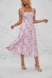 Detail of purple floral dress featuring a lace-up bodice and delicate pleated design